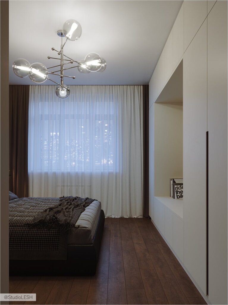 Гладкие фасады мебели для целостности помещения.