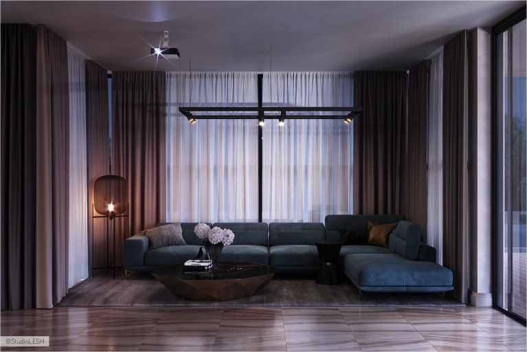 Lounge area with a large green sofa