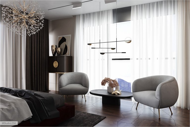 Sitting area in a modern bedroom opposite the window