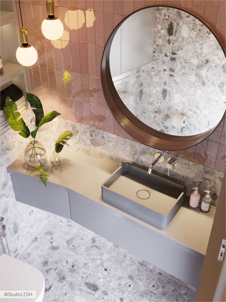 Круглое зеркало и раковина в санузле 