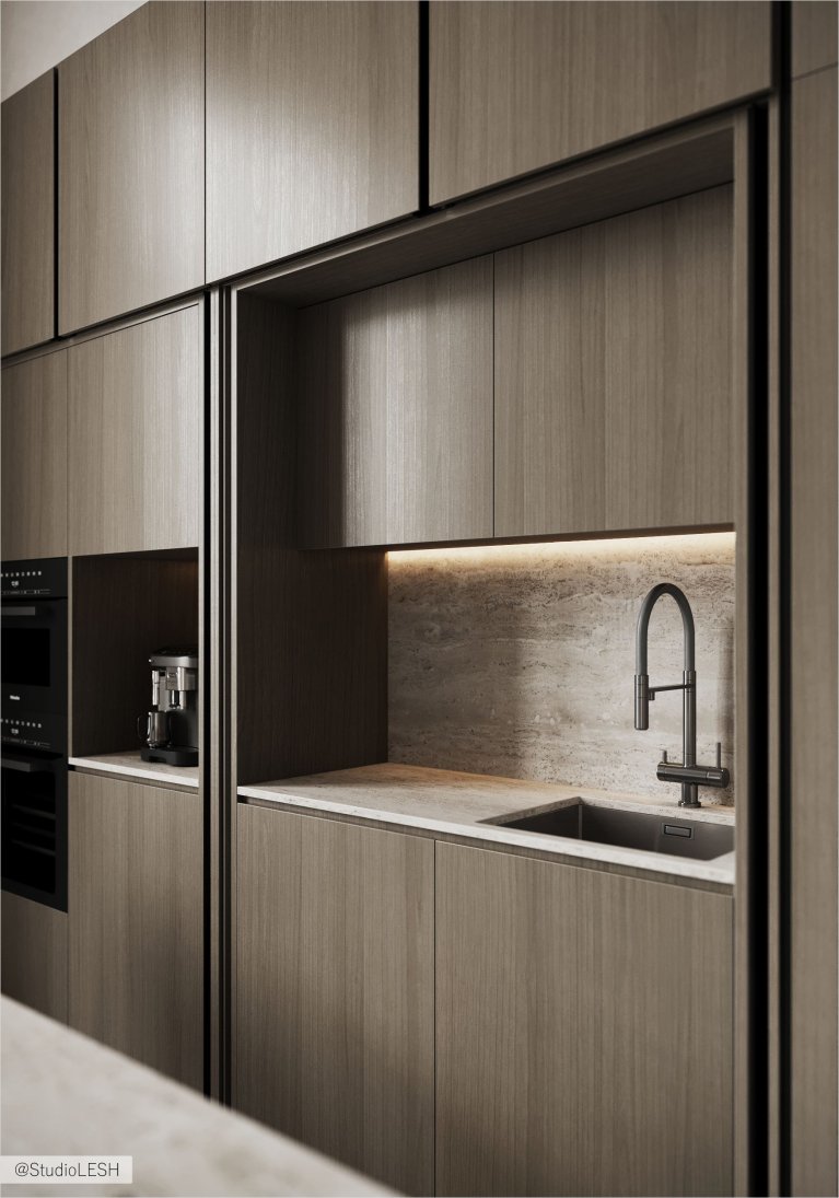 Интерьер современной кухни с гладкими деревянными фасадами, встроенной техникой, минималистичным кухонным гарнитуром и точечным освещением.