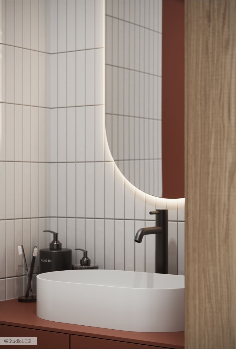 Современная ванная комната с подвесной тумбой и зеркалом с подсветкой.