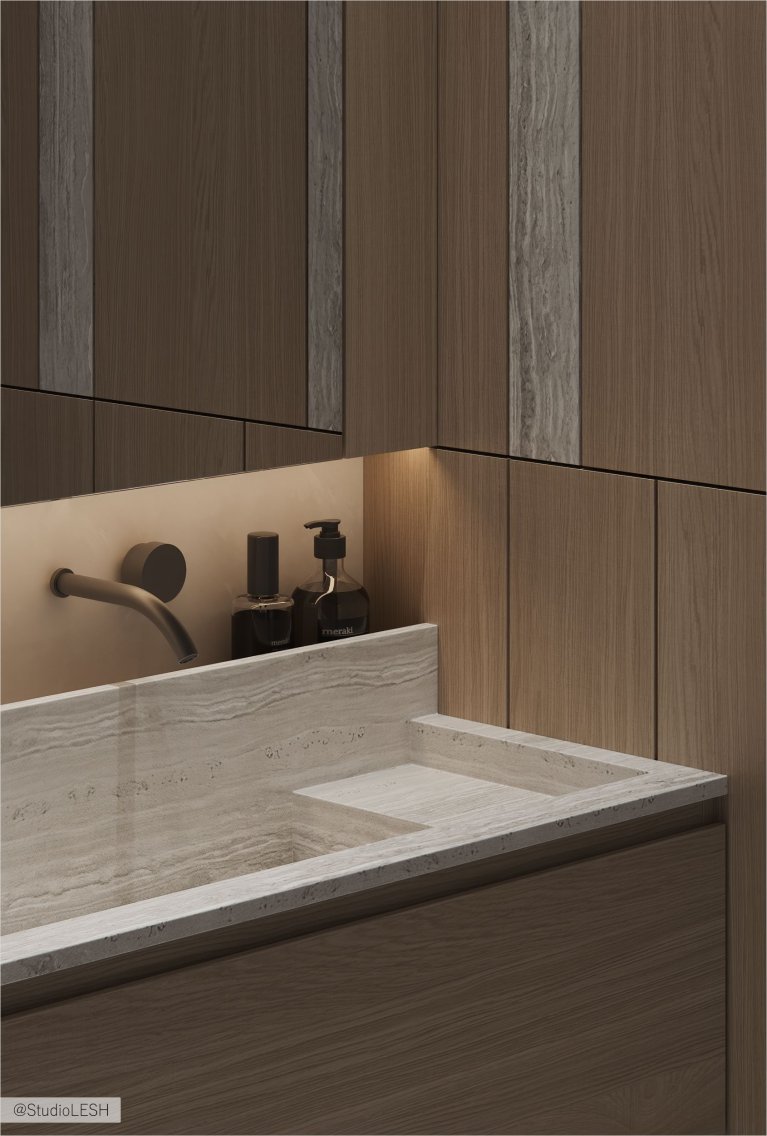 Интерьер современной ванной комнаты с подвесной каменной раковиной, смесителем, встроенным в стену, и деревянными панелями на стене.
