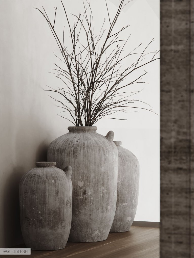 Три керамические вазы с ветками на деревянном столе.